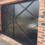 Black Steel Sliding Gate With Panels And A Customised Design