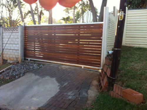 Wooden Sliding Gate With Horizontal Slats And A Steel Frame