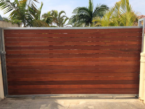 Wooden Sliding Gate With Horizontal Slats And A Steel Frame